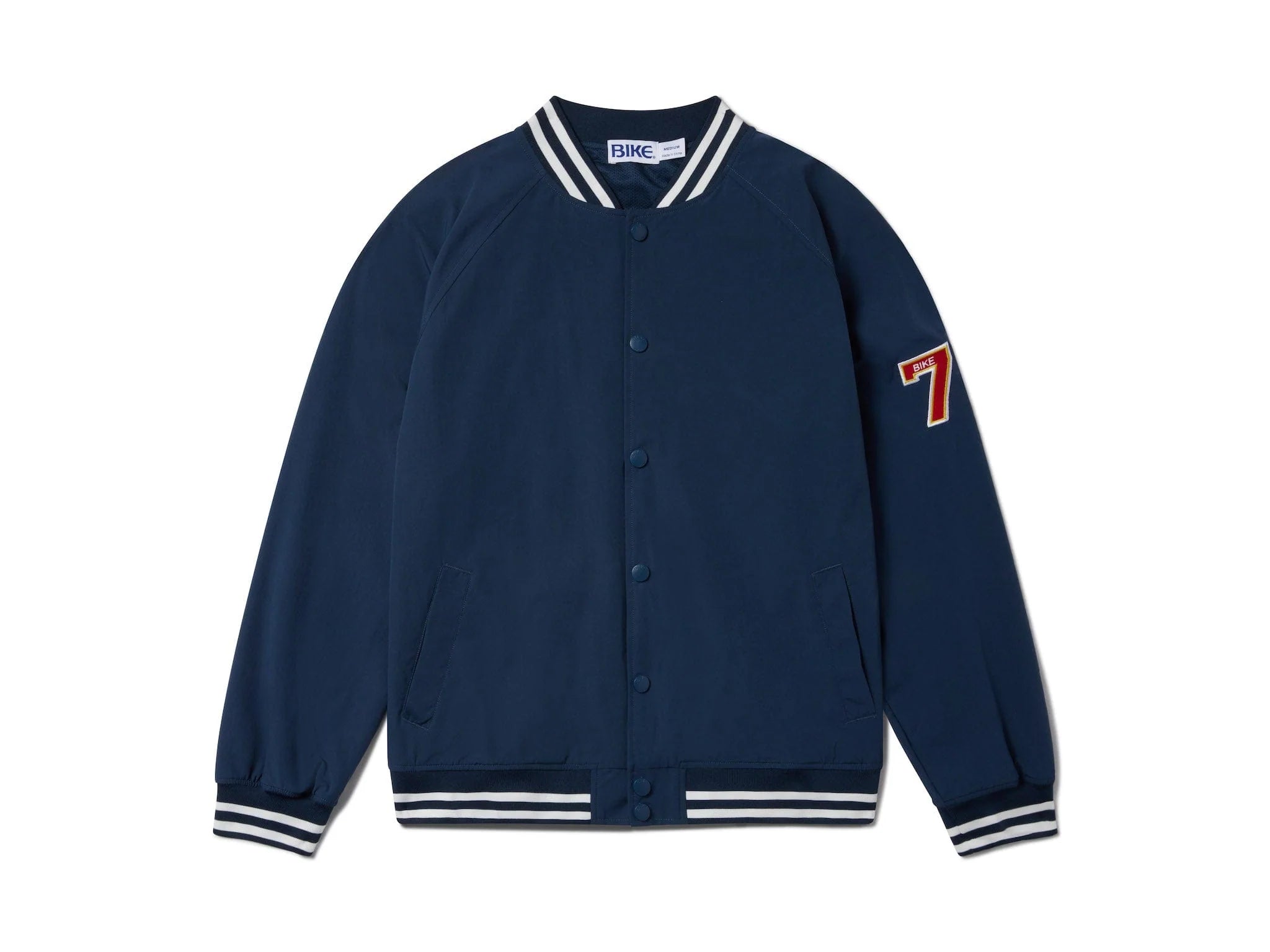 Blue vintage Varsity Bomber Jacket includes tackle twill "74" on the left sleeve, rib-knit collar and cuff, snap front closure, front hand pocket and interior chest pocket, and interior mesh lining.