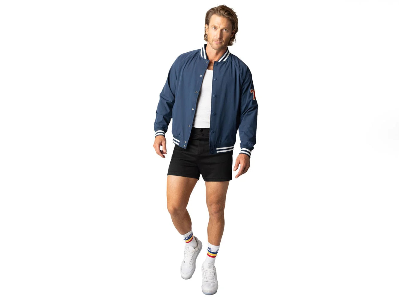 Blue vintage Varsity Bomber Jacket includes tackle twill "74" on the left sleeve, rib-knit collar and cuff, snap front closure, front hand pocket and interior chest pocket, and interior mesh lining.