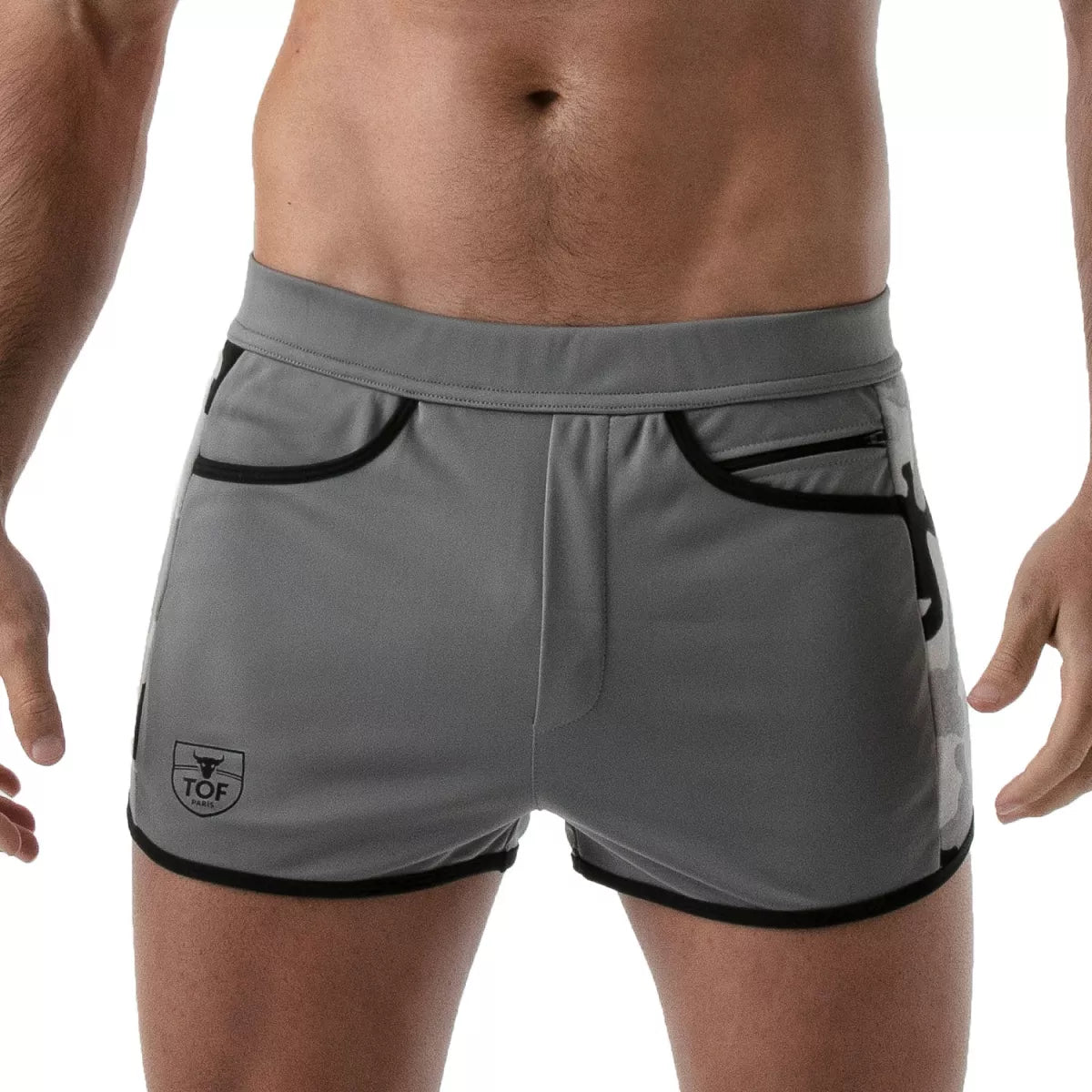 TOF's low-waisted, grey sport shorts have camouflage patterned sides, black outline, and pockets including an additional zipper pocket. The shorts are made of antibacterial microfiber.