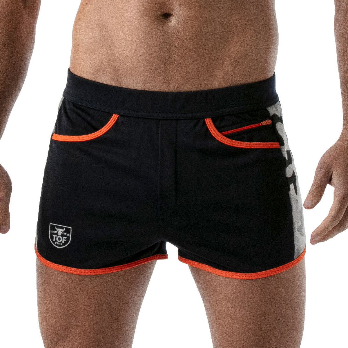 TOF's low-waisted, navy blue sport shorts have camouflage patterned sides, orange outline, and pockets including an additional zipper pocket. The shorts are made of antibacterial microfiber.