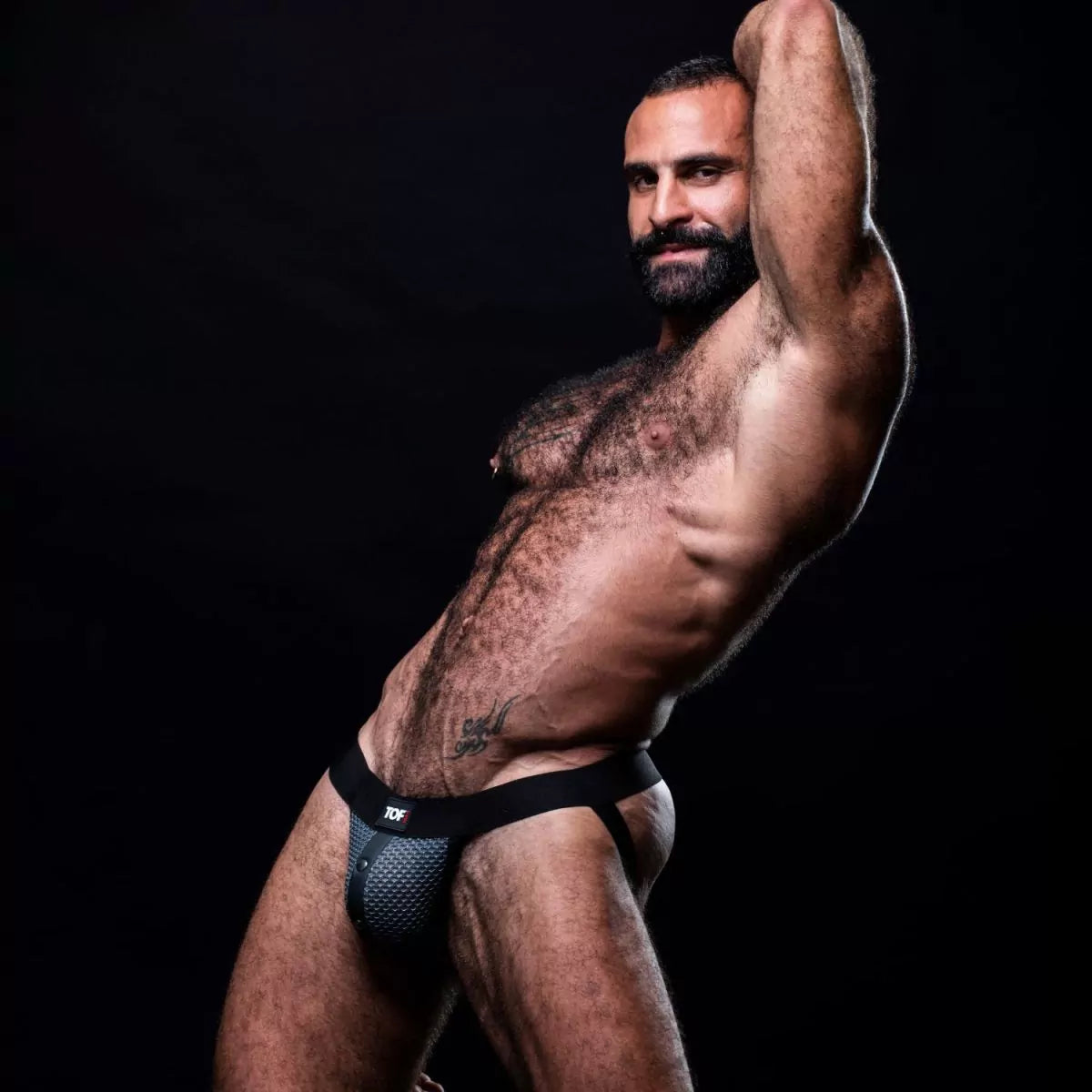 Black and gray snap jockstrap made from breathable 3D mesh. This jockstrap has a fitted front pocket that snaps in place.