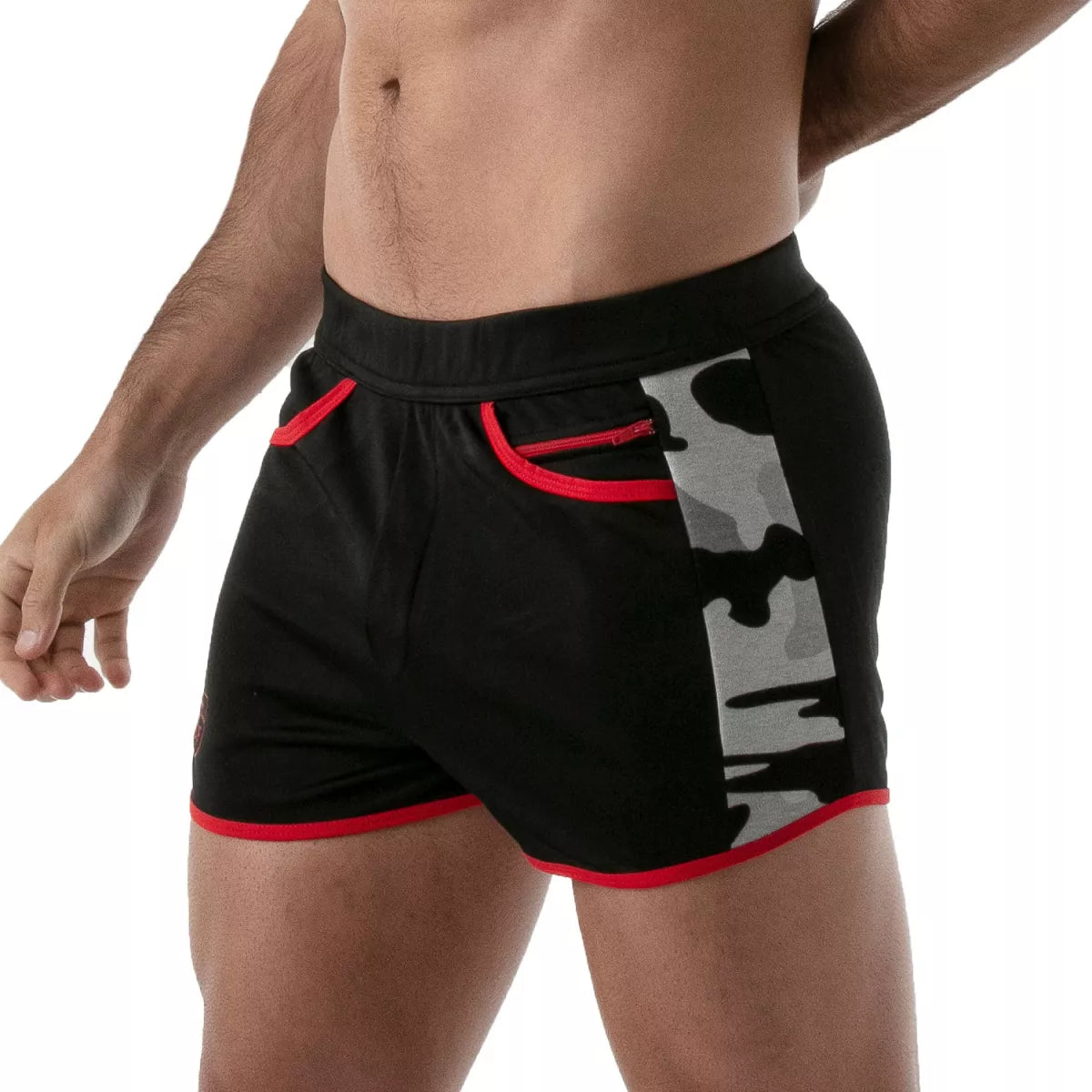 TOF's low-waisted, black sport shorts have camouflage patterned sides, red outline, and pockets including an additional zipper pocket. The shorts are made of antibacterial microfiber.