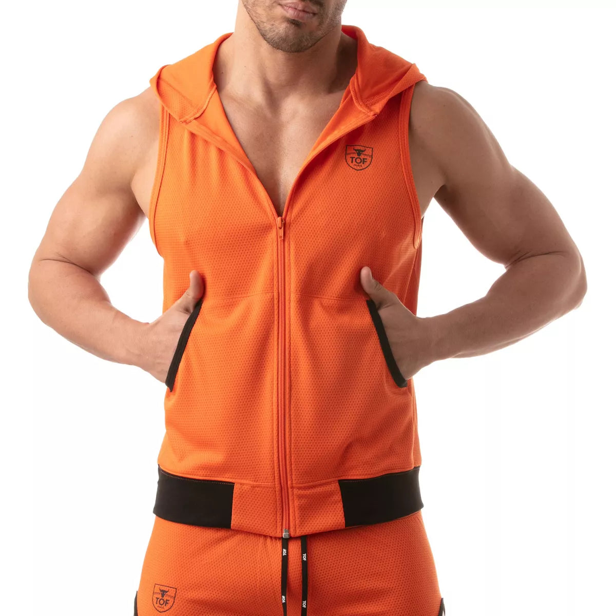 TOF's ultra-light sleeveless hooded jacket is made of polyester microfiber fabric. This hoodie has pockets, zipper front, and TOFs iconic logo over the chest.